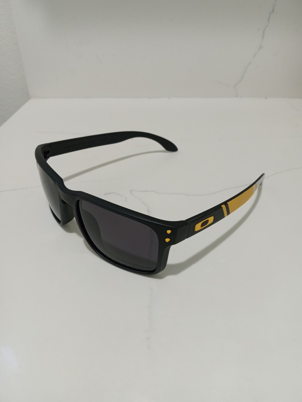 Oakley Black Sunglasses with Gold Temple Accents